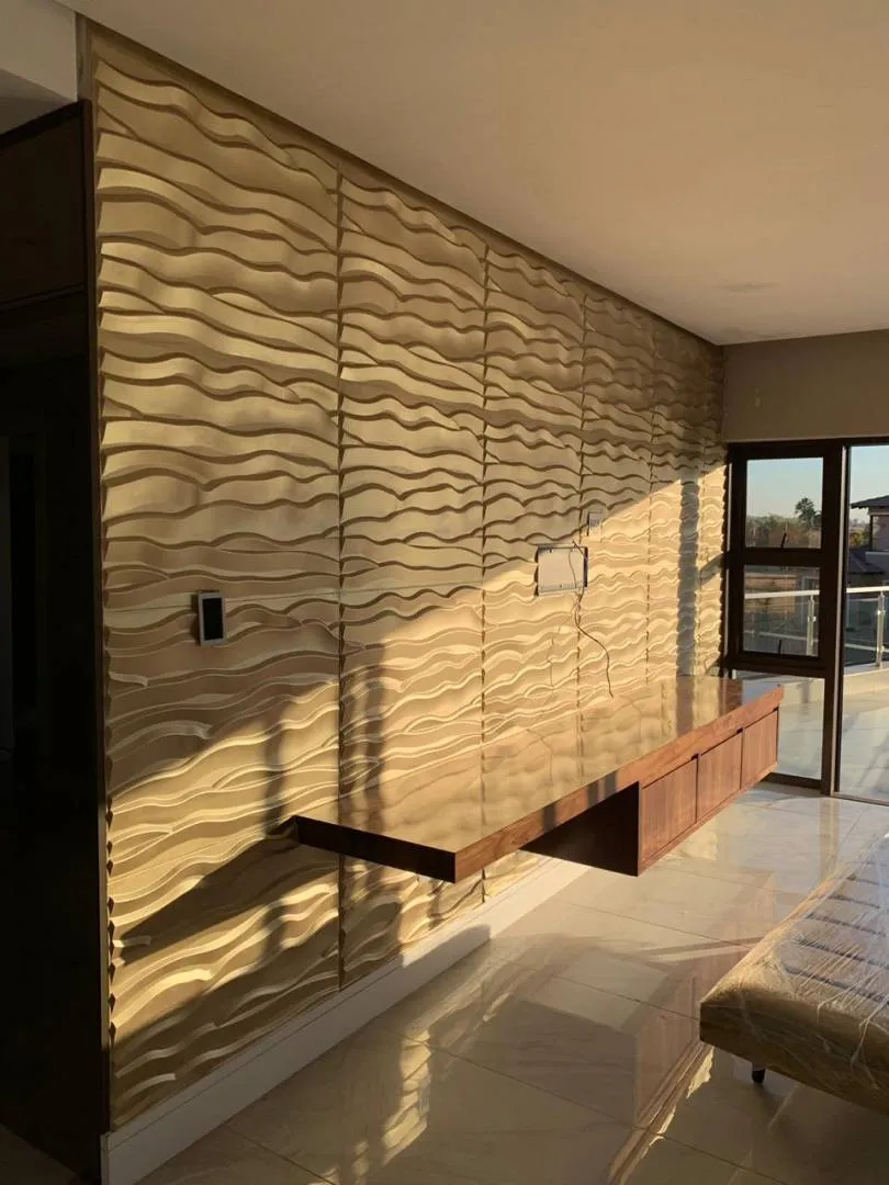 3D feature wall in gold — signage and branding by Stiek Industries