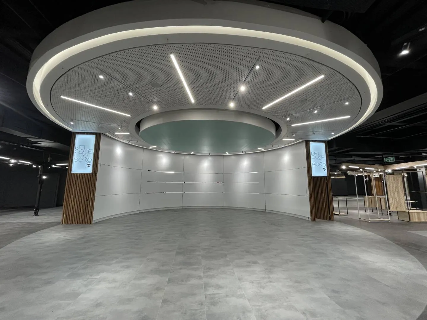 Illuminated hanging circular lightbox — signage and branding by Stiek Industries