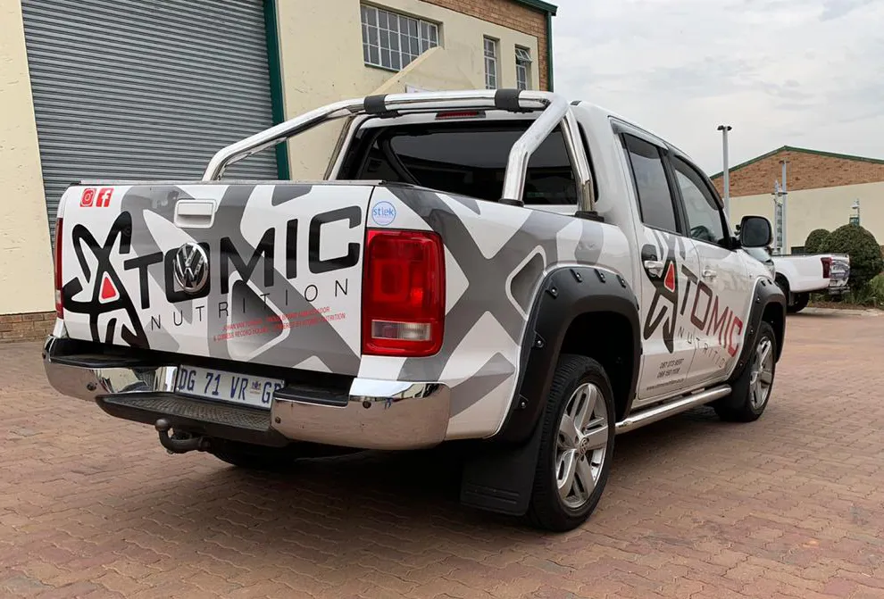 Vehicle branding — Atomic — signage and branding by Stiek Industries
